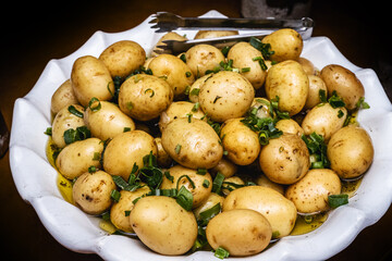 Brazilian baked potato, barbeque and bar snack, served in a restaurant, with salad and oil.
