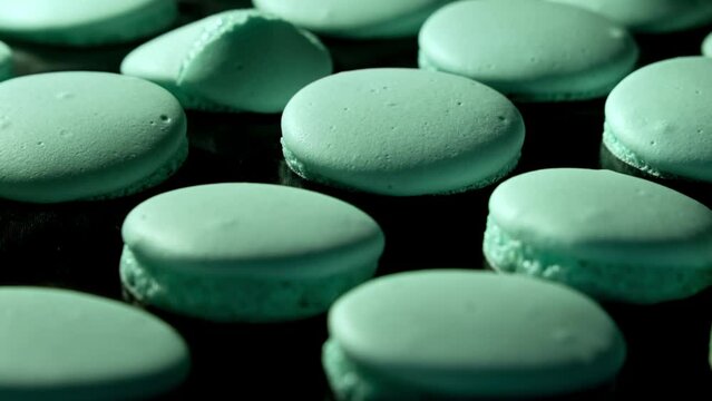 Baking blue macaroons in electric oven. Failed process. Exploded macarons. Failure of baking macarons. Timelapse of growing macarons. Delicious dessert. Mistake in process of cooking macaroons