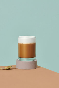 coffee latte on glass on brown table