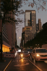 Buildings and road traffic at evening on Manhattan in New York City.