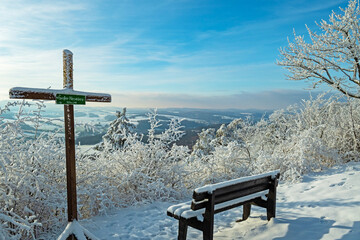 view from great Horselberg mountain with castle Wartburg at the horizon in winter