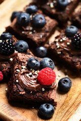 Chocolate brownies with hazelnut cream and berries.