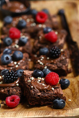 Chocolate brownies with hazelnut cream and berries.