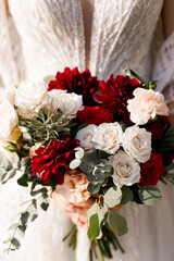 Wedding bouquet of red and white roses bride holding flowers bunch white dress bridal elegance flower rose 