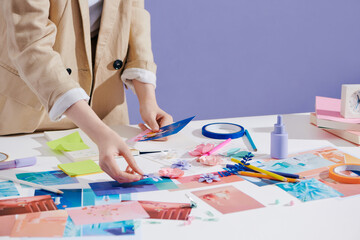 Product photographer checking her photos at workplace
