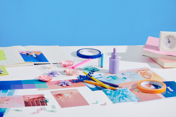 Artist workspace with reference ideas and palette for new product