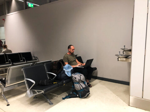 UGC freelancer working remote in airport lounge