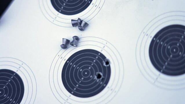 competition in shooting, paper target and gun pellets. High quality 4k footage