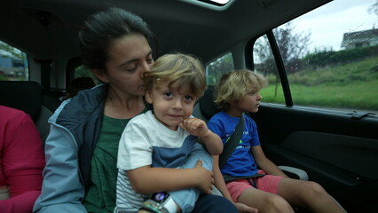 Kids in car back seat mother and child inside vehicle transportation