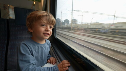 Kid travels by train going for vacation looking out window waving goodbye