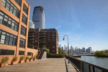 Fototapeta na wymiar contemporary buildings and embankment of Hudson river in New York City.