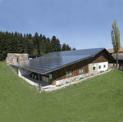 Switzerland: Solrenergy-panel on the roof of a farmhouse.