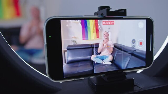 closeup view of a mobile phone streaming a live video of a gay man. High quality 4k footage