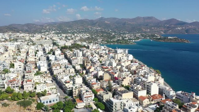 Aerial view of Agios Nikolaos, a picturesque coastal town with colorful buildings around the port in the eastern part of the island Crete, Greece