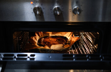 Basque cheesecake is baked in the oven.Spanish Cheesecake San Sebastian