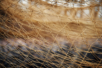 Nets for catching wild animals in the forest. Trapping game animals. Unraveling trapping nets