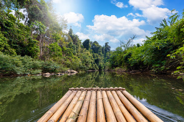 First person view of a bamboo float in a river cruise adventure in the Khao Sok national park,...