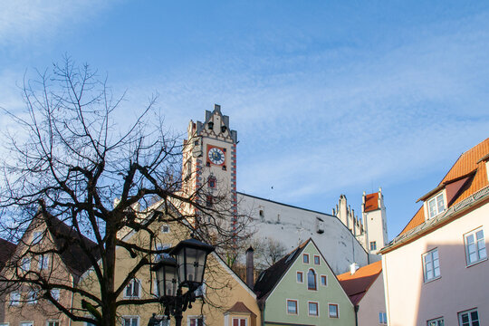 Fuessen, Germany - January 14th 2023: Historic housing buildings and the castle in the old town