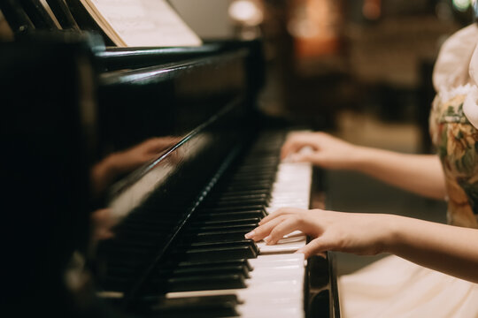 young woman playing piano
