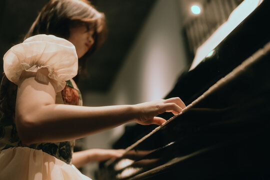 young woman playing piano