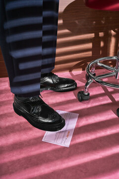 Business man stepping on receipt