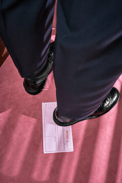 Business man stepping on receipt