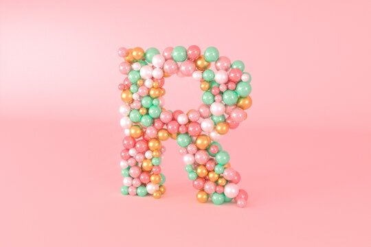 Letter R made of glass balls, pastel pearls, crystal jewels and gold.