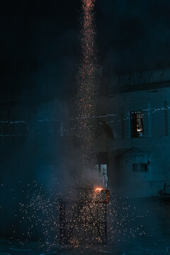 Fireworks going from the launching platform leaving a trail of sparks