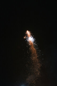 fireworks exploding in the air against a black sky 