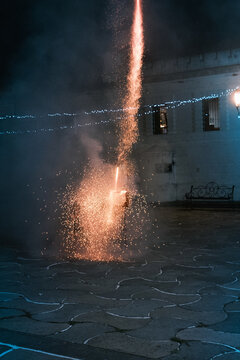 Fireworks going from the launching platform leaving a trail of sparks