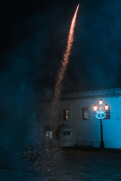 Fireworks going from the launching platform leaving a trail of sparks