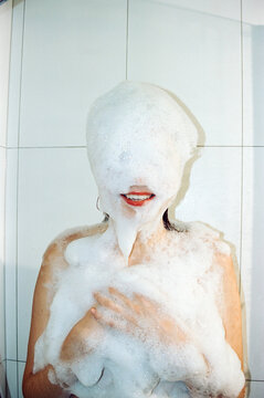 A woman in shampoo foam