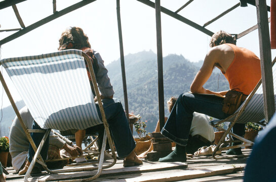 1970s Travelers Hanging Out on Kabul Rooftop - Powered by Adobe