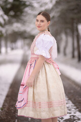 Fototapeta premium Young beautiful slovak woman in traditional dress. Slovak folklore