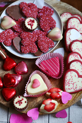 Sweets for Valentine's Day. Chocolates and cookies in the form of hearts.