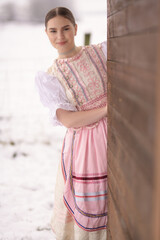 Young beautiful slovak woman in traditional dress. Slovak folklore