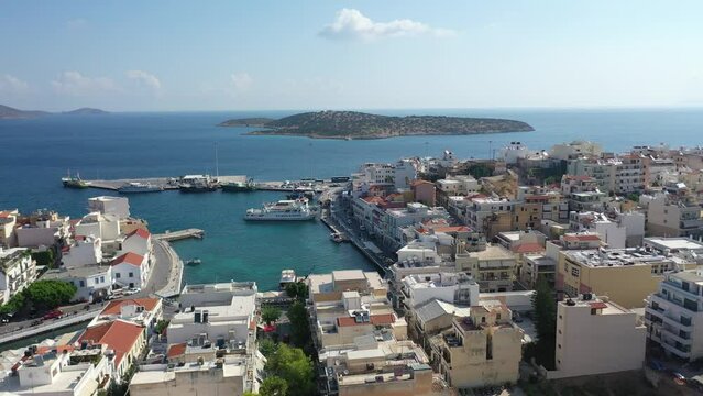Aerial view of Agios Nikolaos, a picturesque coastal town with colorful buildings around the port in the eastern part of the island Crete, Greece