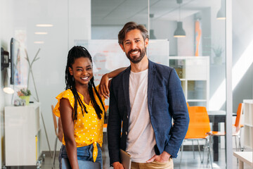 Happy african american woman with her boss at the office
