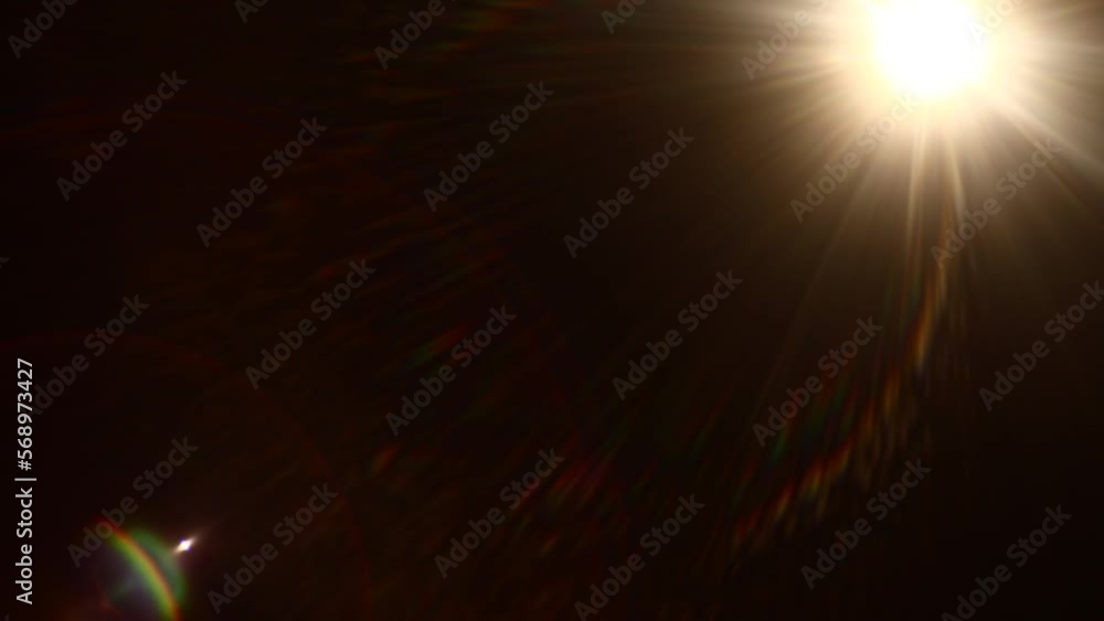 Aufkleber Easy to add lens flare effects for overlay designs or screen blending mode to make high-quality images. Abstract sun burst, digital flare, iridescent glare over black background.