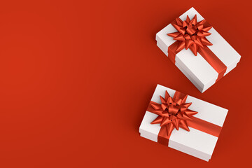 Gift boxes with ribbon and bow for Merry Christmas flying and falling on red