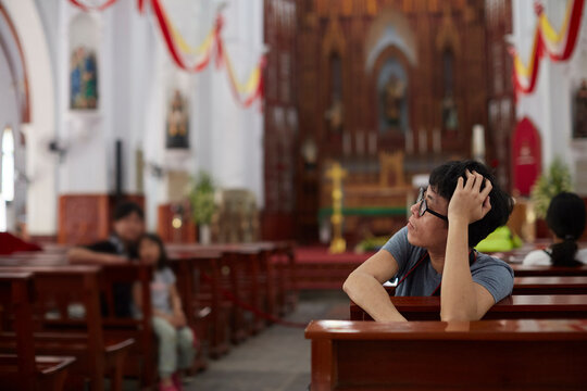 Close up Asian man in church, stare and meditate