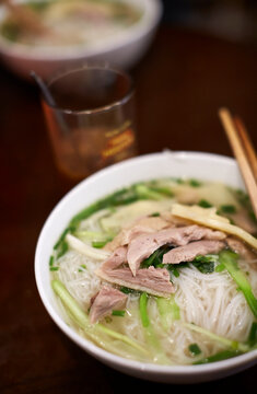 Closeup vietnamese street food, rice noodles with chicken