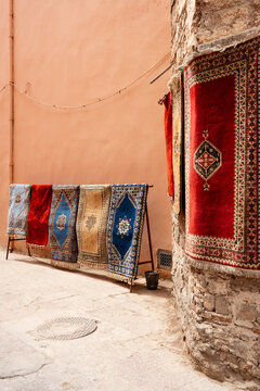 Carpets on sale along a street in Marrakech, Morocco