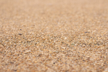 Fototapeta na wymiar Road and floor surface. Rough sand carpet. Template design, decorative element, texture. Photo closeup