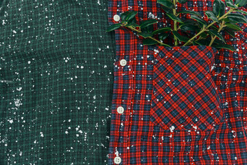 Close-up of the branches in the checkered shirt pocket.