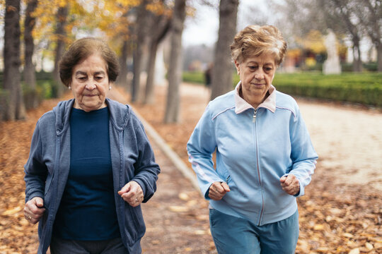 Senior women jogging in the park in the morning