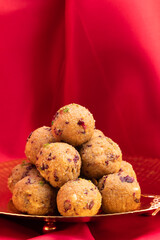 Indian Mithai Gulab Churma Ke Laddu Or Choorma Ke Ladoo Is Made Of Whole Wheat Jada Gehun Ka Atta, Khus Khus, Gur, Jaggery, Kaju, Badam, Edible Rose Petals, Dry Fruits In Desi Ghee Or Clarified Butter
