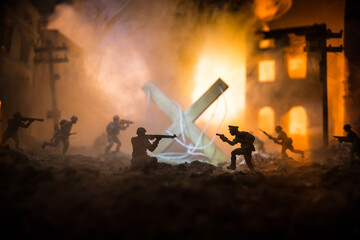 Concept of war or manipulation with global politics. The puppeteer controls soldiers. Night battle scene. Military fighting silhouettes in destroyed city.