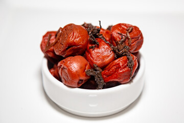 Japanese umeboshi, traditional kind of fermented salted plum with red shiso leaves.