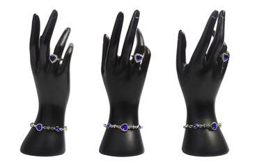 Luxurious jewelry set on mannequin hand: bracelet and ring with heart shape blue stones. Fashion jewelry, symbol of love, 3 views, isolated. Present for women.